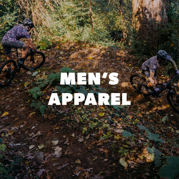 Two people mountain biking through a forest with 'Men's Apparel' text overlay.