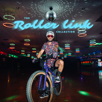 Person riding a bicycle in a dark indoor setting with colorful lights and 'The Roller Link Collection' sign.