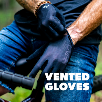 Person wearing black gloves with text 'Vented Gloves' in a forest setting