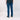 Person wearing blue jeans on a white background