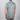 Person wearing a colorful floral shirt with a neutral background