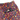Close-up of patterned shorts with a side pocket holding a black smartphone. The fabric has a dense retro abstract print in hot pink, yellow, and turquoise on a black base, with a visible HANDUP brand tag on the pocket.