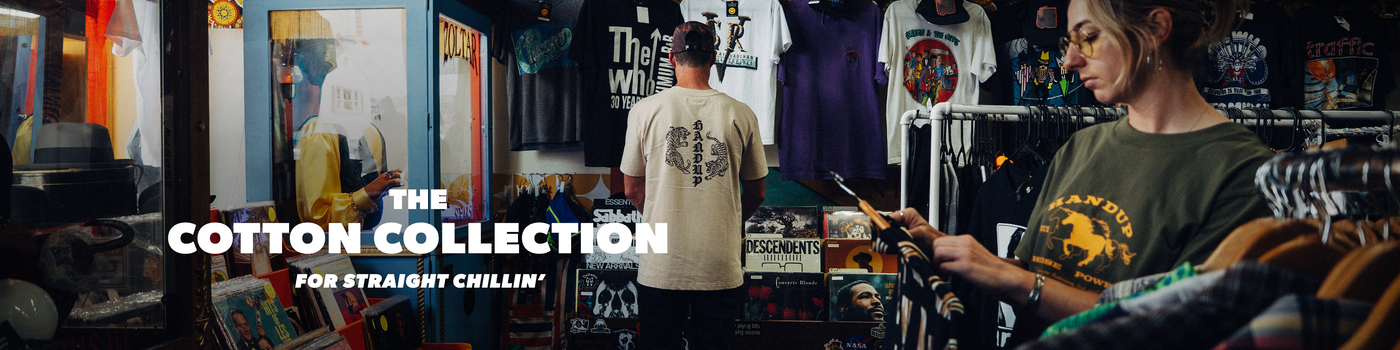 A retail store interior with clothing racks, shirts, and a person browsing while another person stands nearby. Large overlaid text reads 'THE COTTON COLLECTION' and 'FOR STRAIGHT CHILLIN''.