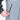 close up of a person unzipping the pocket of a grey and black jacket
