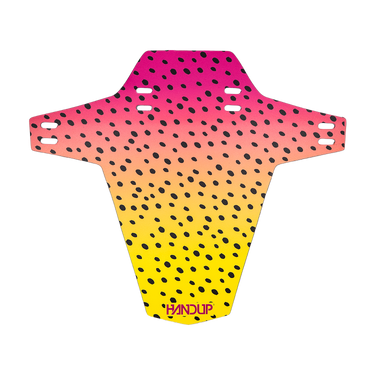 A protective bicycle helmet pad by BANDUP, featuring a vibrant pink, orange, and yellow gradient with a black spotted pattern, shown on a solid white background.