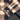 Close-up of a plaid fabric with buttons on a textured surface