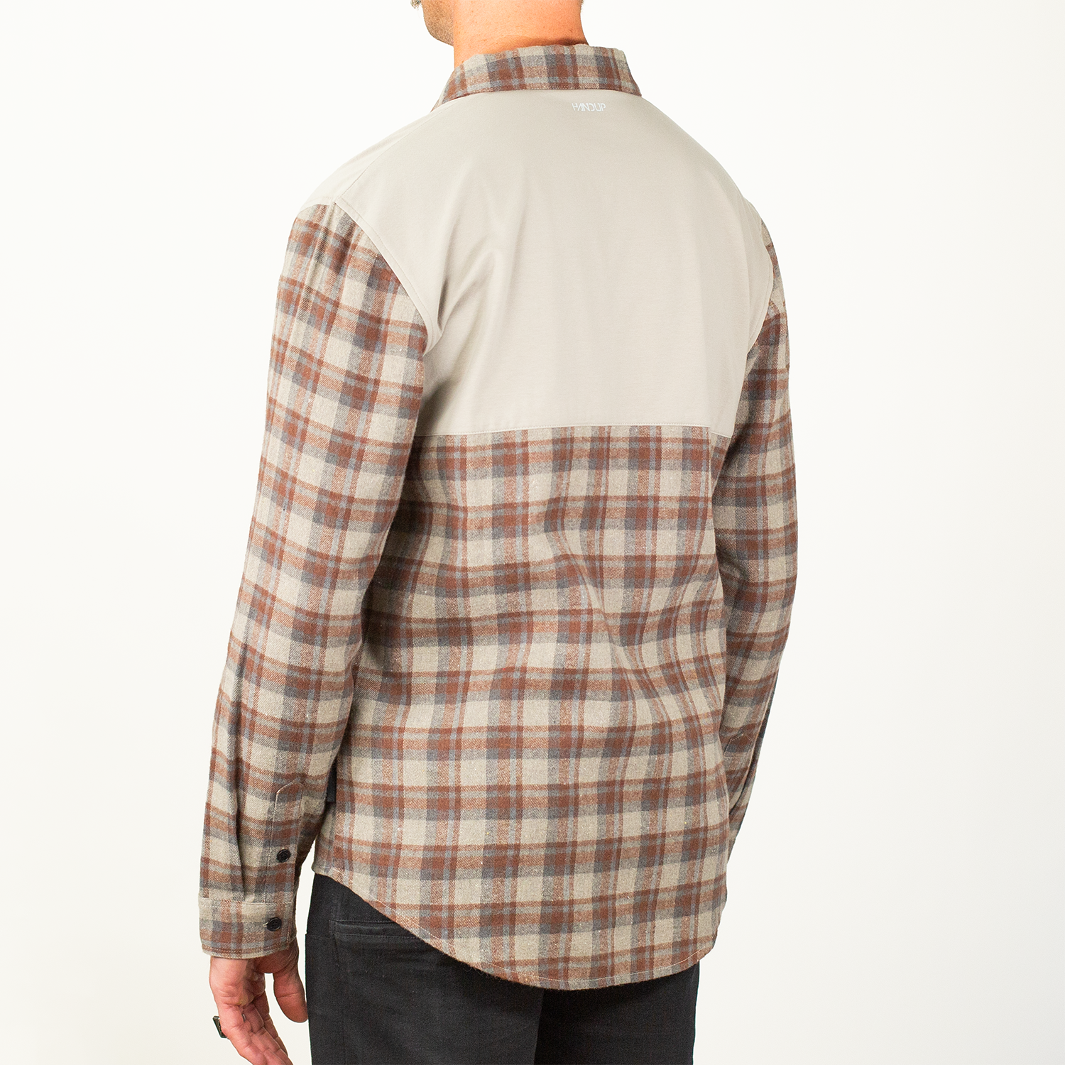 Plaid shirt with beige and brown pattern on a white background