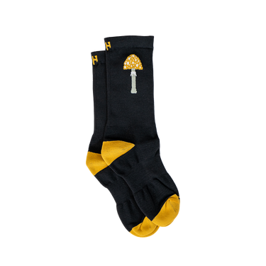 Black socks with yellow accents and a mushroom design on a white background