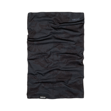 A black performance neck gaiter with a subtle tonal camouflage pattern, featuring the HANDUP brand logo near the top right and a white logo at the bottom left, shown flat on a white background.