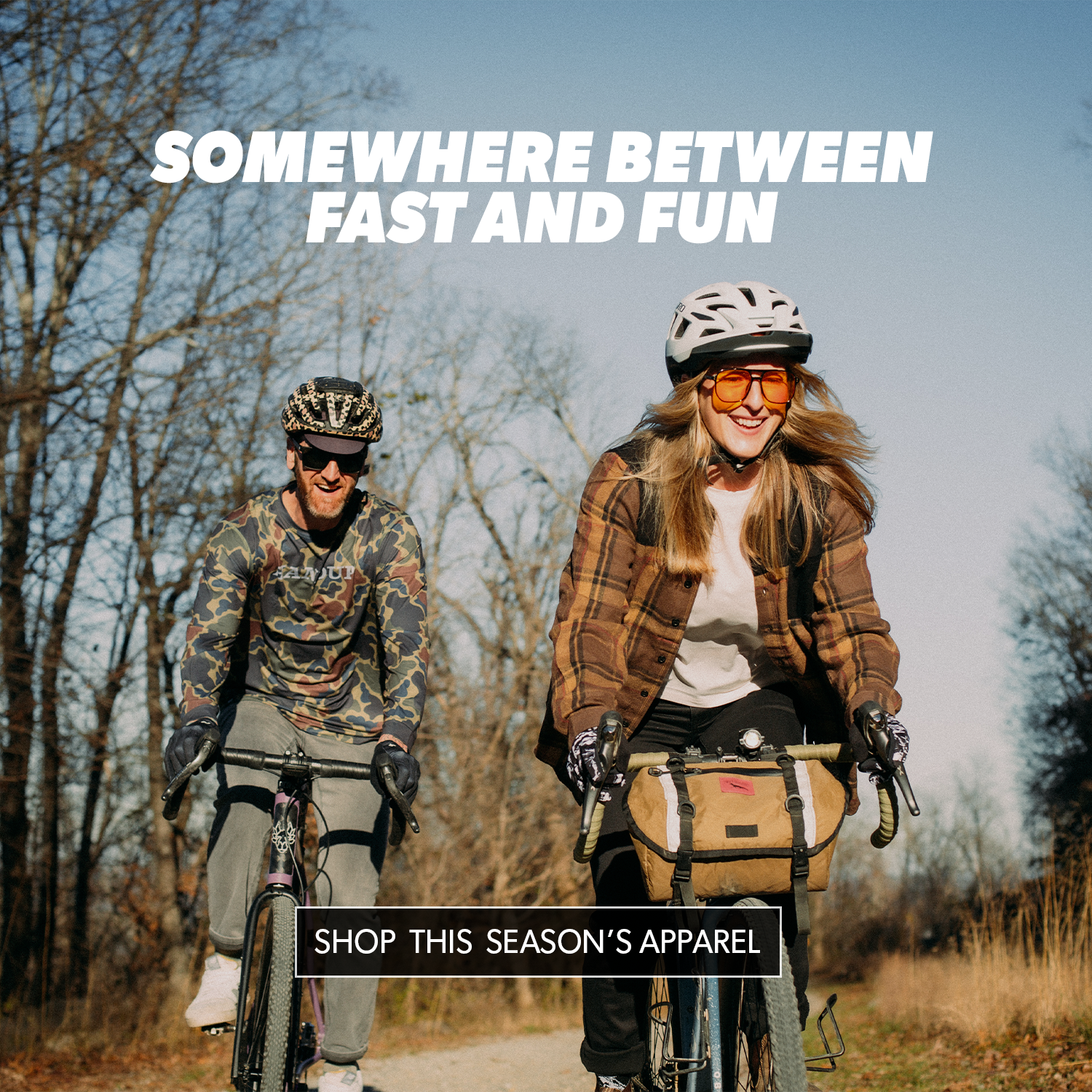 Two people riding bicycles on a trail with text overlay 'Somewhere Between Fast and Fun' and 'Shop This Season's Apparel'.