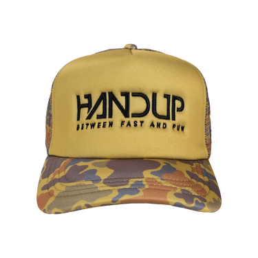Yellow and camouflage trucker hat with 'HANDUP' logo on a white background