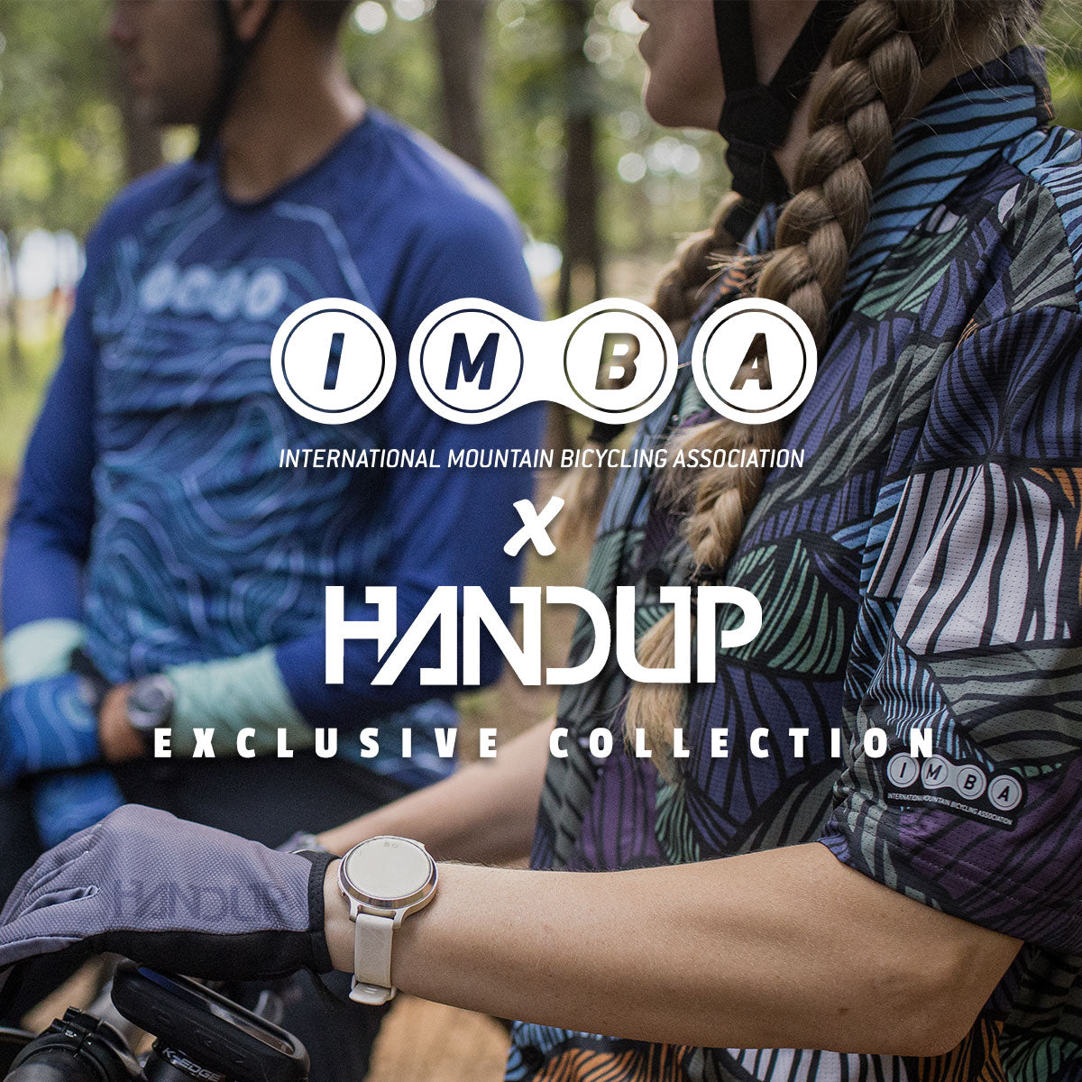 Two people in mountain biking gear with 'IMBA' and 'Handup' logos overlayed.