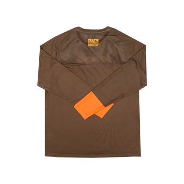 A brown long-sleeve protective shirt with a mesh chest panel and an orange tag attached to the sleeve, displayed flat against a white background.
