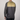 Back view of a long-sleeve athletic shirt with mesh panels on a plain background