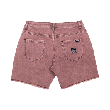 Back view of a pair of washed dusty rose denim shorts with a frayed hem, featuring a black and white 'GP US' patch on the right back pocket and a 'PHILIP' label on the left.