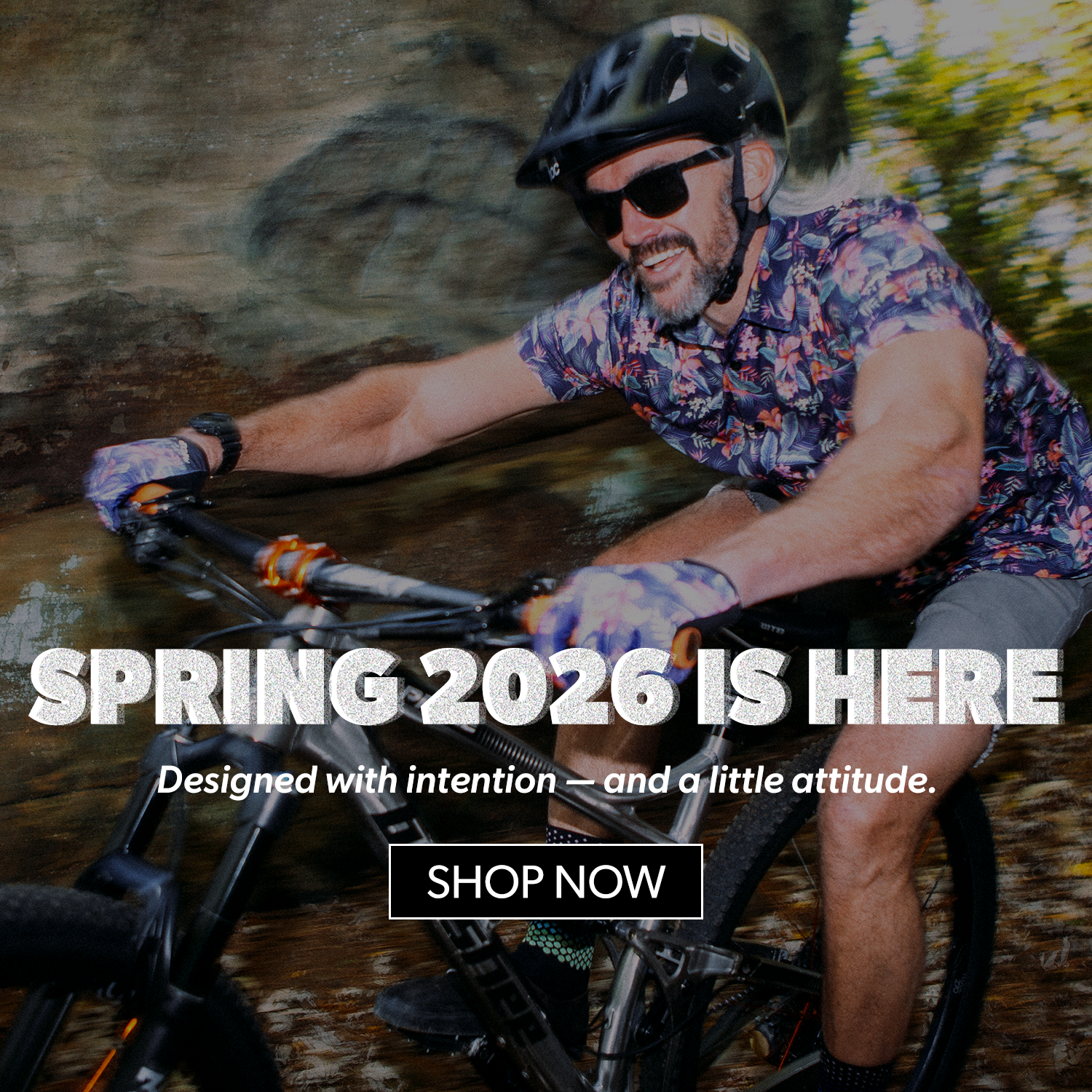 Man riding a bicycle with text promoting Spring 2026 products and a call to action to shop now.