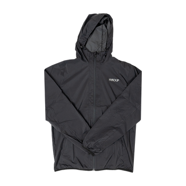 A black packable wind and rain resistant jacket with front zipper pockets and a hood, displayed in a folded manner against a white background.