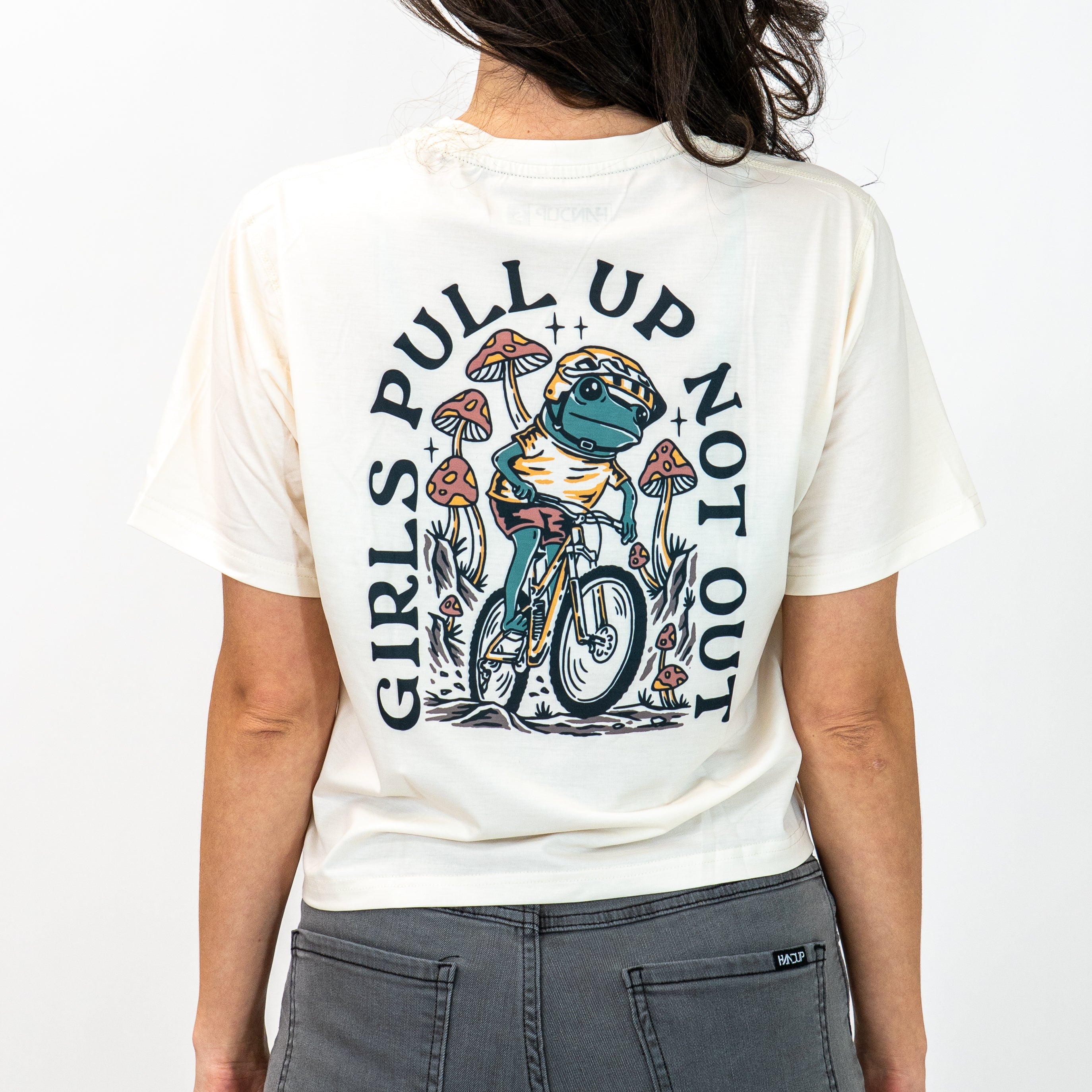 person wearing off-white cropped tech tee with a frog riding a bicycle image