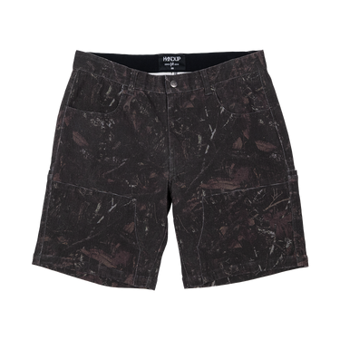 A pair of dark charcoal and black cargo shorts with a distressed, mottled paint-splatter pattern, featuring a button closure and side cargo pockets, shown flat on a white background.