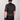 Person wearing a black cycling jersey with mesh panels on a plain background