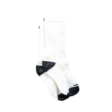 A pair of white crew socks with black heel and toe accents.