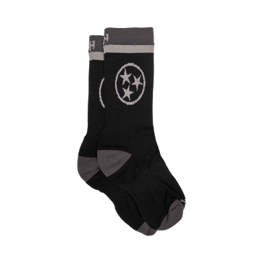 Black socks with a gray star design on a white background