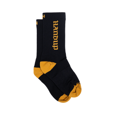 Black socks with yellow accents and 'Handup' branding on a white background