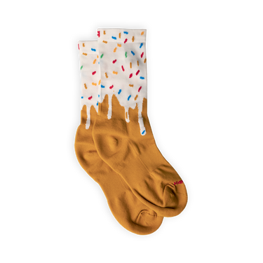 A pair of socks with a gradient color change from beige to white at the top, resembling a ice cream cone with colorful sprinkles.