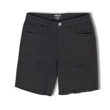 A pair of black stretch jorts with pockets on the sides, button and zipper closure at the front, and a tag visible on the waistband.