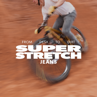 person riding a bike in dirt with super stretch jeans text overlay