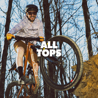 man riding a bike wearing a long sleeve shirt that says HANDUP