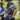 Two people riding bicycles in a forested area