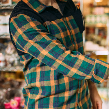 man wearing a plaid button up shirt 