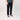 Person wearing black pants and black sneakers on a plain background