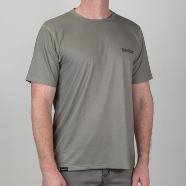 Person wearing a green t-shirt with 'HANDUP' branding on a gray background