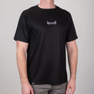 Person wearing a black t-shirt with a logo on a gray background