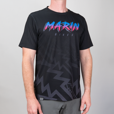 Black t-shirt with colorful 'Marin Bikes' logo on a gray background