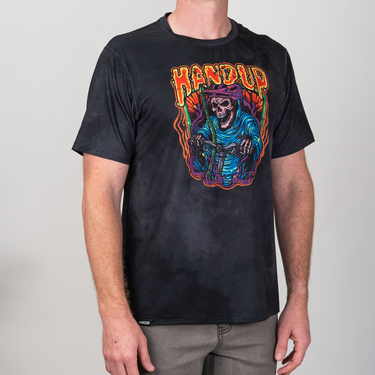 Black t-shirt with colorful graphic design on a plain background