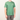 Person wearing a green t-shirt with a logo on a white background
