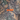Camouflage pattern with 'HANDUP' logo in orange on a natural background