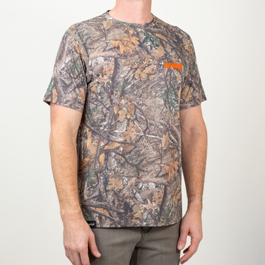 Person wearing a camouflage t-shirt with a brand logo on a white background
