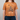 Person wearing a brown t-shirt with a graphic design and text on a plain background