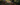 Two people mountain biking through a forest with 'Men's Apparel' text overlay.