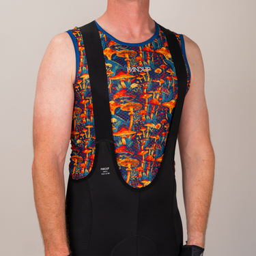Person wearing a colorful mushroom-patterned cycling bib with 'Vandor' branding on a plain background