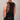 Person wearing a colorful cycling bib with a neutral background