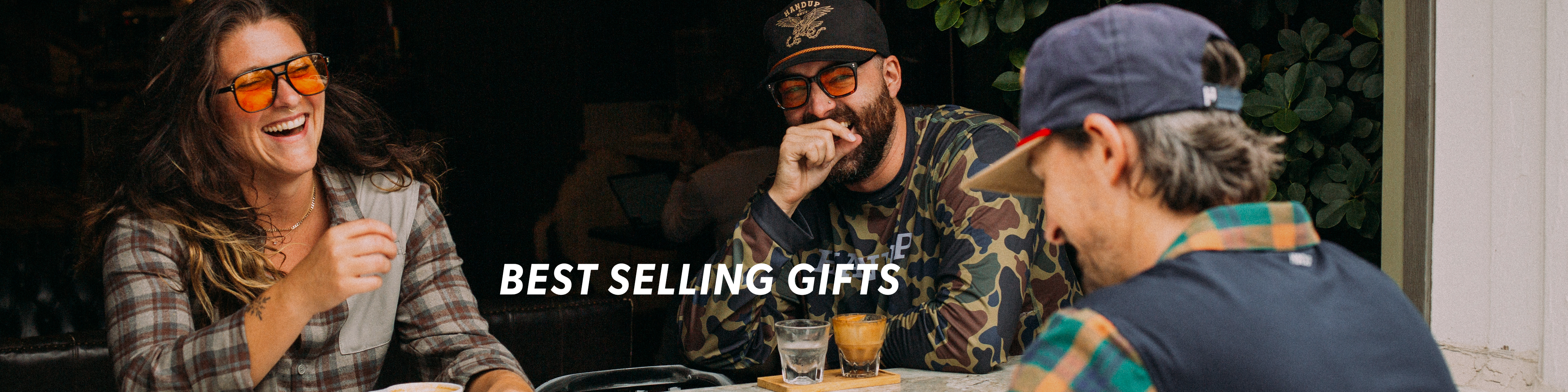 Three people sitting together with a 'Best Selling Gifts' text overlay.