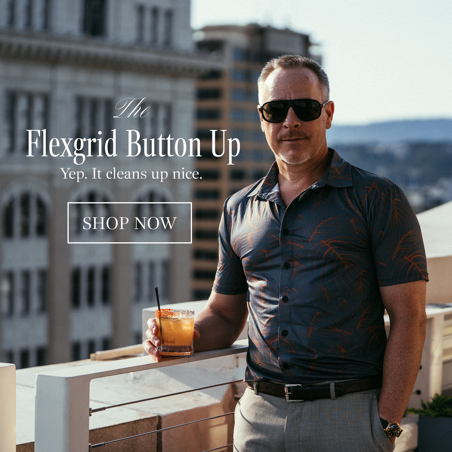Man holding a drink on a rooftop with text promoting 'The Flexgrid Button Up'.