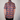 Person wearing a colorful mushroom pattern shirt against a plain background