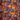 Colorful pattern of mushrooms and skulls with a dark background