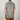 Person wearing a patterned shirt with a neutral background